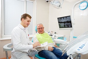 Man smiling at the dentist