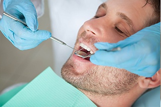 Relaxed man receiving dental exam