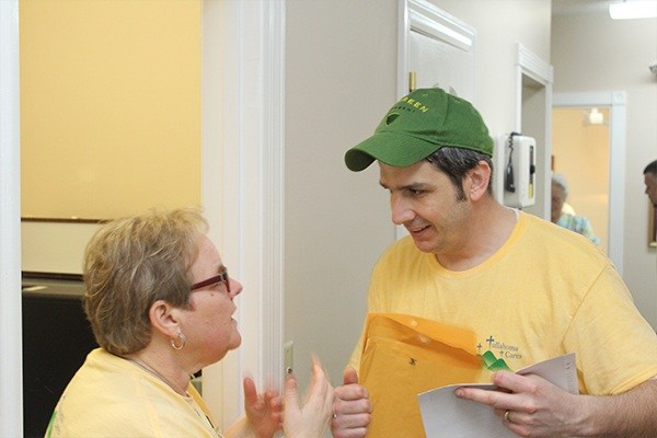 Two dental team members at community event