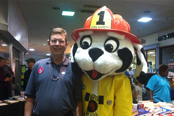 Dentist and fire dog mascot