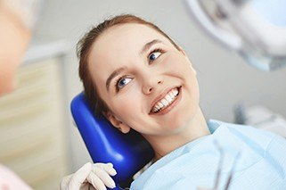 Smiing woman in dental chair