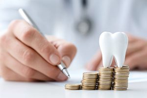 Person budgeting for the cost of dental care