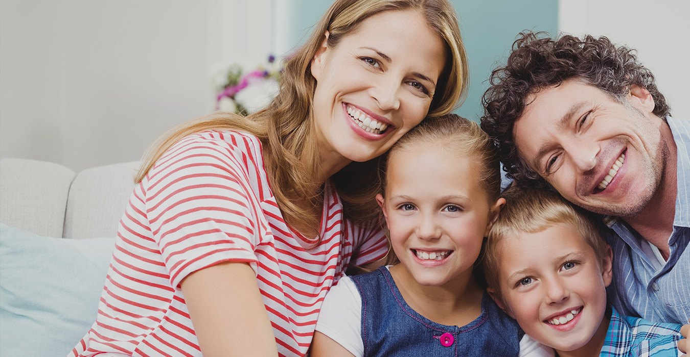 Smiling mother father and children