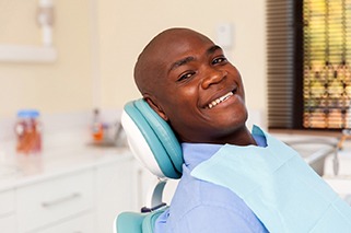 Man smiling in dentist’s chair