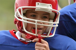 Preteen boy with sportsguards