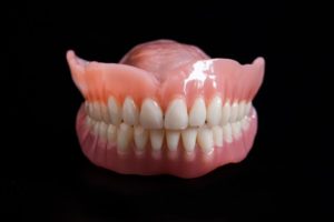 Pair of dentures on a reflective table