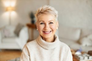 woman smiling with strong teeth and jawbone from Vitamin K2